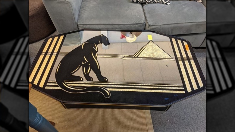 Brass and black table with design