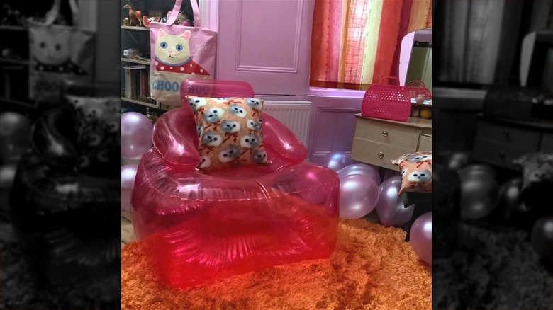 Inflatable pink chair in pink room