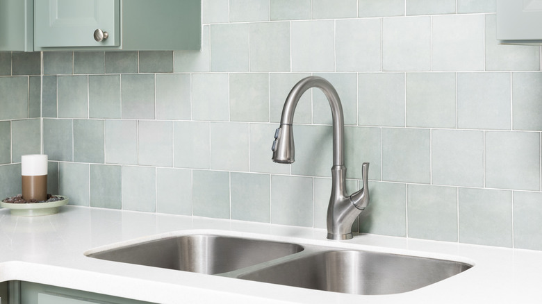 Square tile backsplash in kitchen