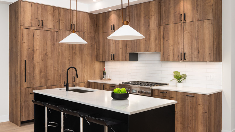 A kitchen with warm wood cabinets