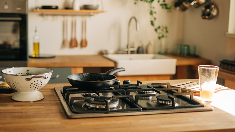 closeup of wood counter with stovetop