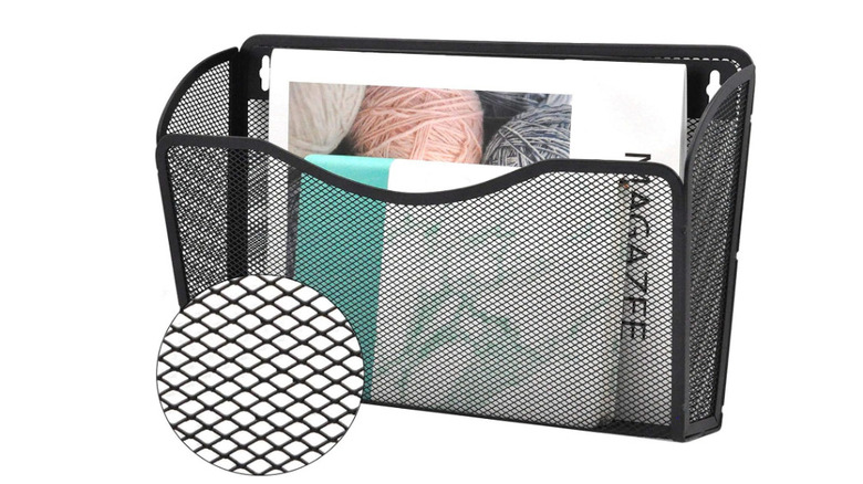 Black wire mesh magazine rack in advertisement photo