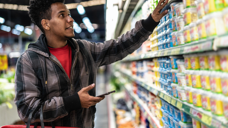 Person shopping for butter