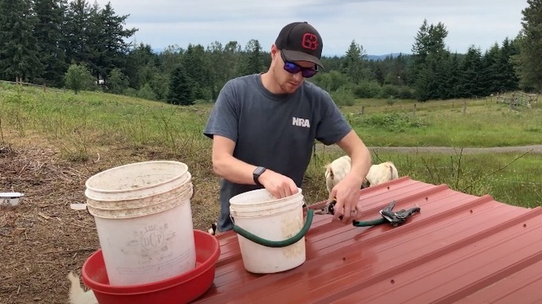 fixing bucket with garden hose