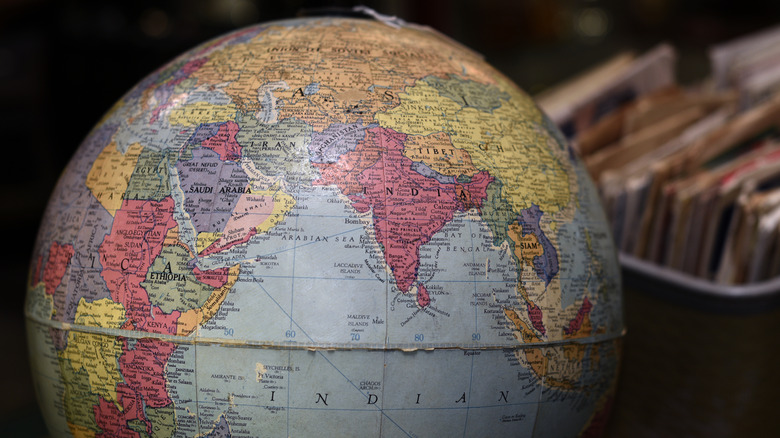 An up close view of a vintage globe on table