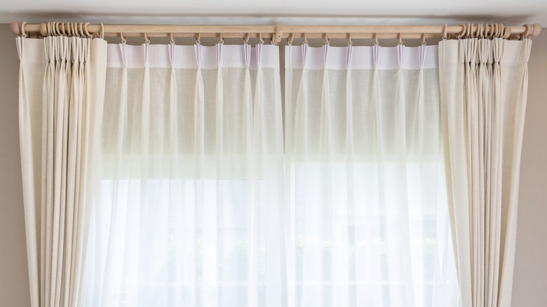 Cream and white curtains in a window