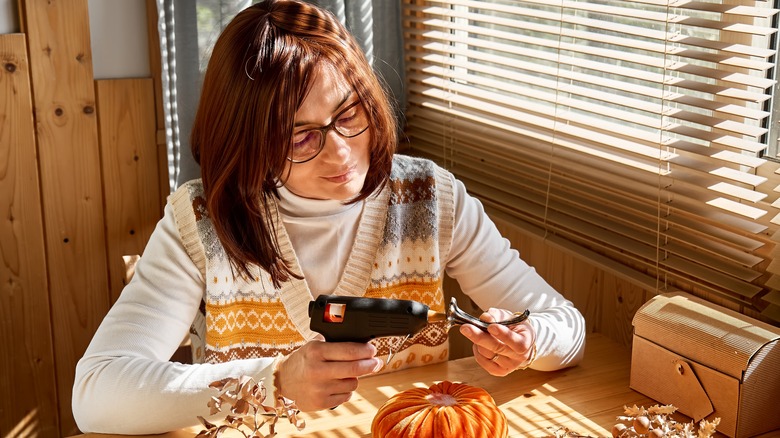 woman making fall decorations