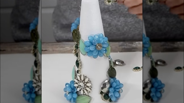 Adding costume jewelry to white foam cone