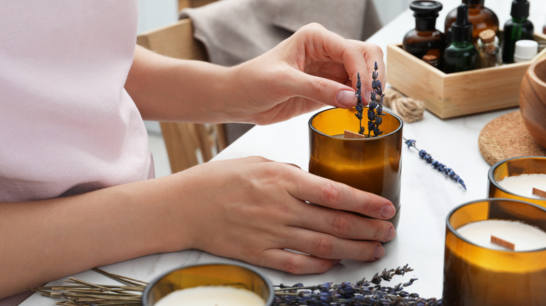 adding dried lavender to candle