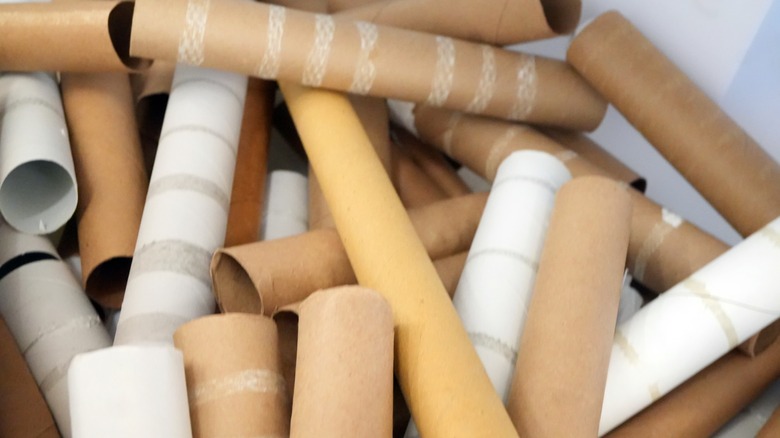 a pile of empty paper towel rolls