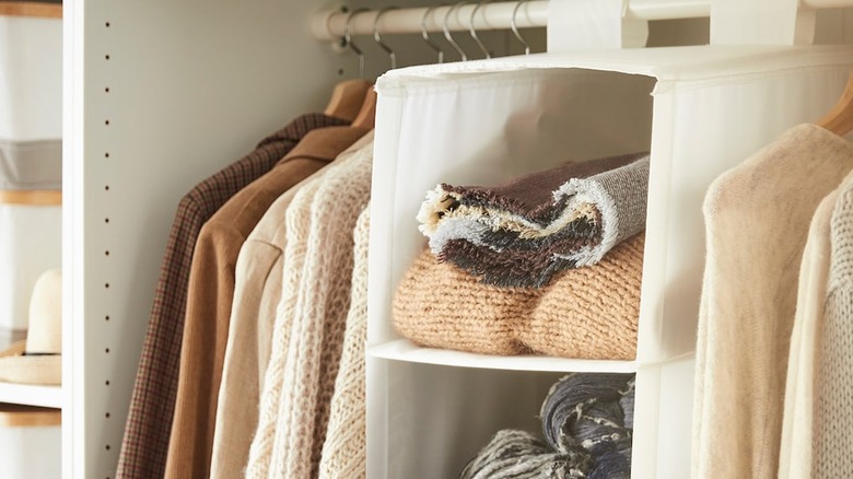 White closet organizer with blankets