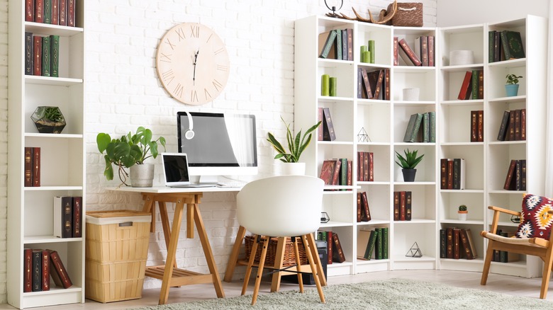 White bookshelves in an office.