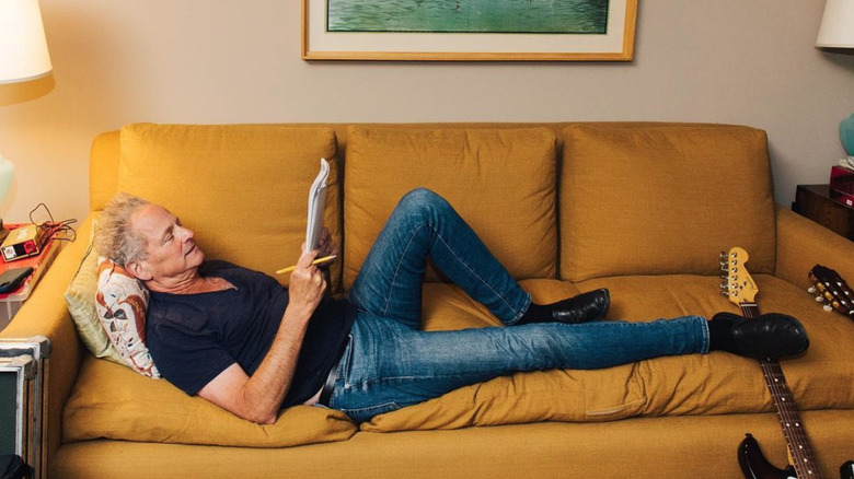 Lindsey Buckingham on sofa