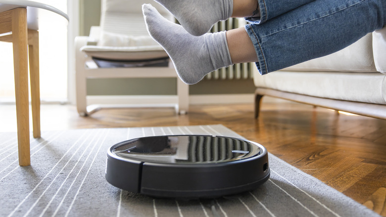 robot vacuum on gray rug