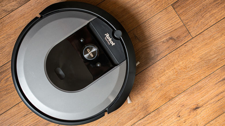 Roomba vacuum on hardwood floor