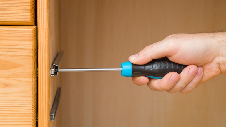 Hand with screwdriver 