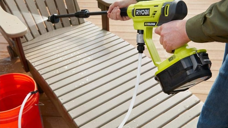 A person using a Ryobi power cleaner