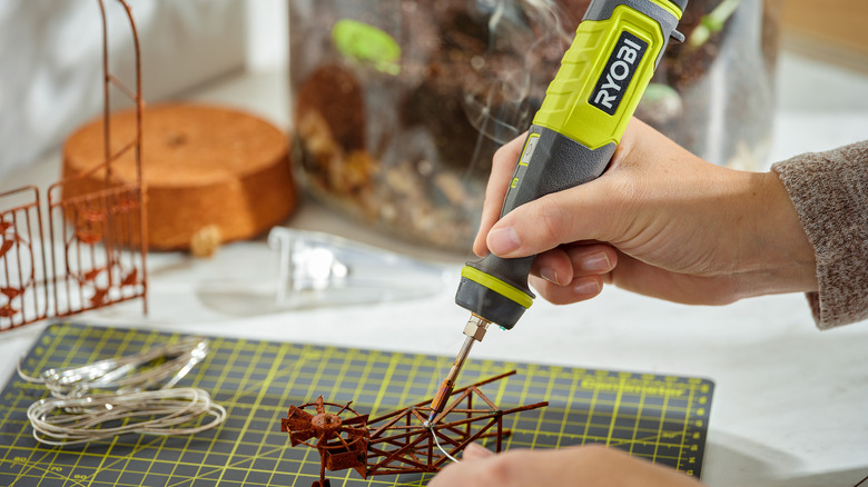 Person using ryobi soldering pen