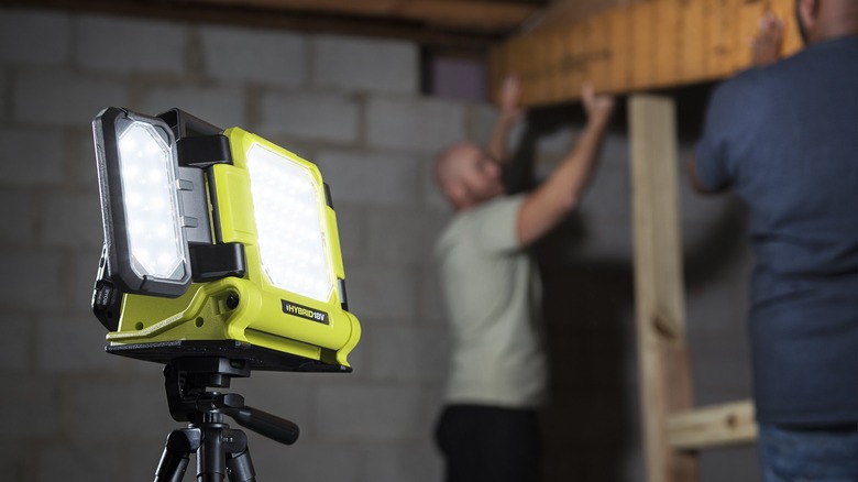 Man in basement with worklight