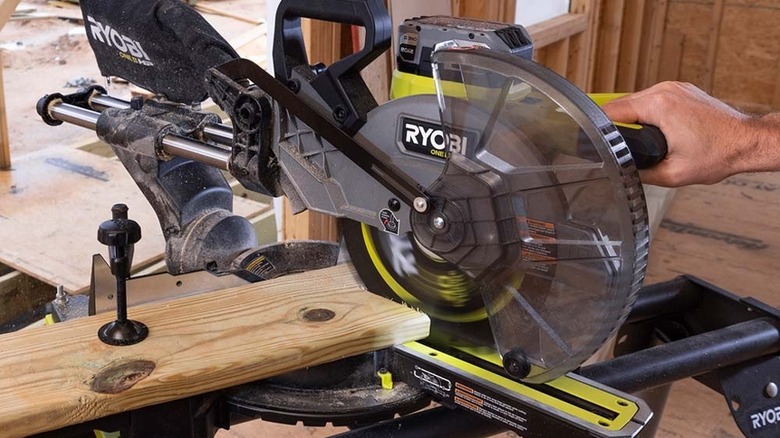 person using a miter saw