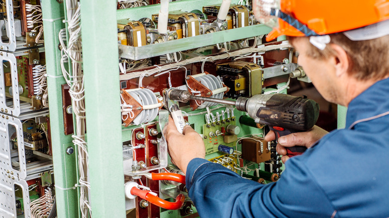 Electricity worker fixing transformer