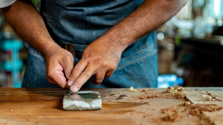 Woodworker sharpening a chisel