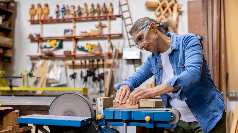 Woodworker operating a machine