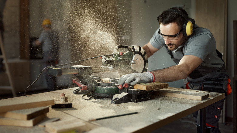 Woodworking wearing earmuffs