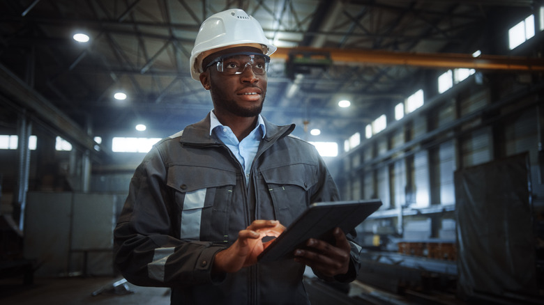 contractor with tablet at worksite