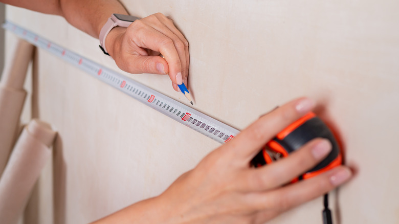 tape measure against the wall