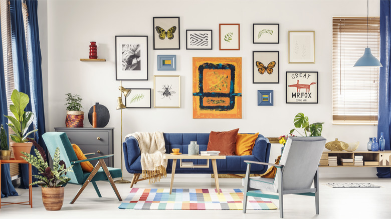 colorful gallery wall above couch