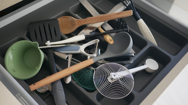 messy kitchen utensil drawer