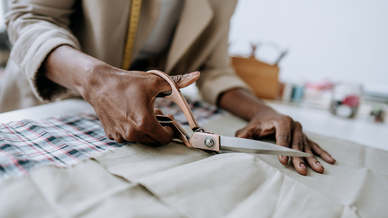 Woman cutting fabric