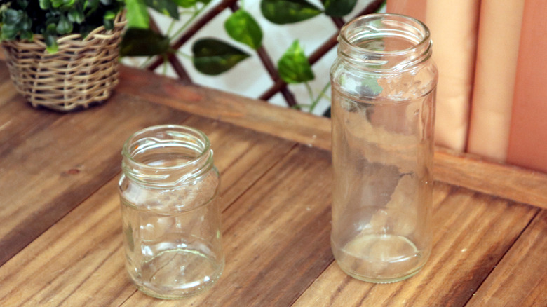 Two glass jars on a wooden surface