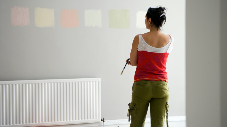 Woman looking at paint samples