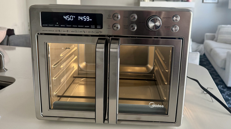 Midea Flexify oven during initial heating period to burn off debris