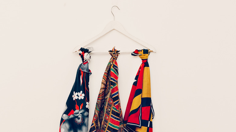 Scarves knotted on a hanger