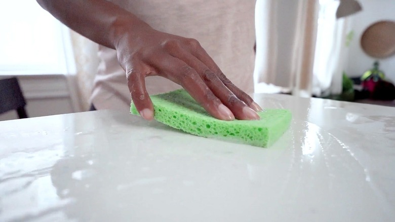 Woman wiping her counter