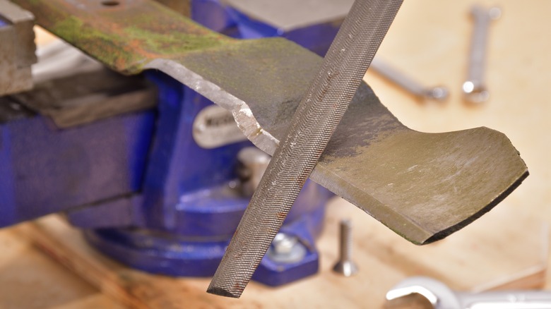 sharpening a lawn mower blade