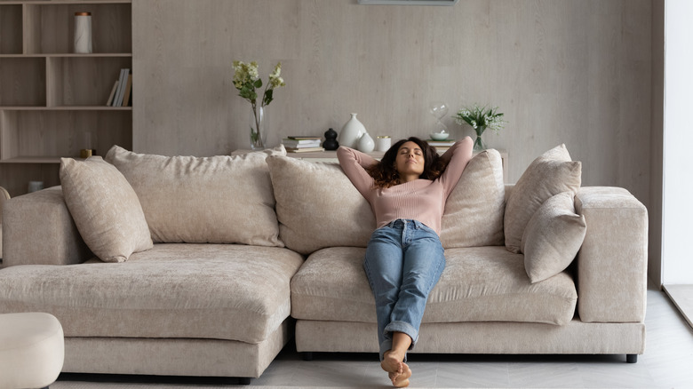 Woman relaxing in living room