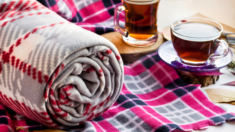 Fleece blankets with cups of hot tea