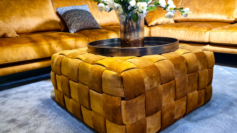 Matching gold sofa and ottoman 