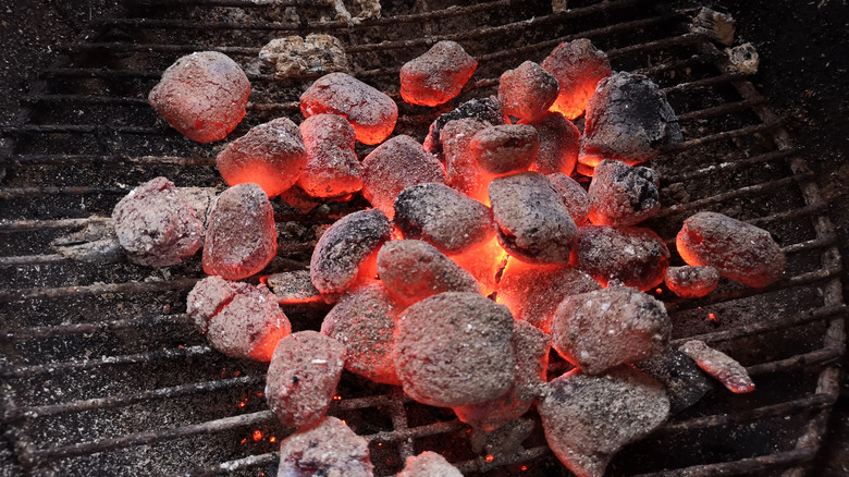 burning gray charcoal on grill