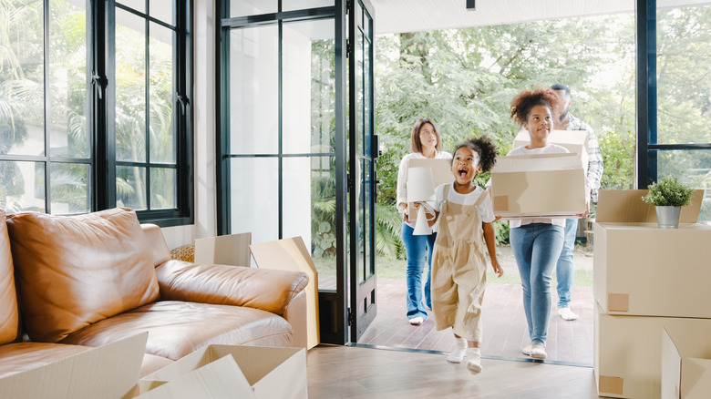 Family walking into new home