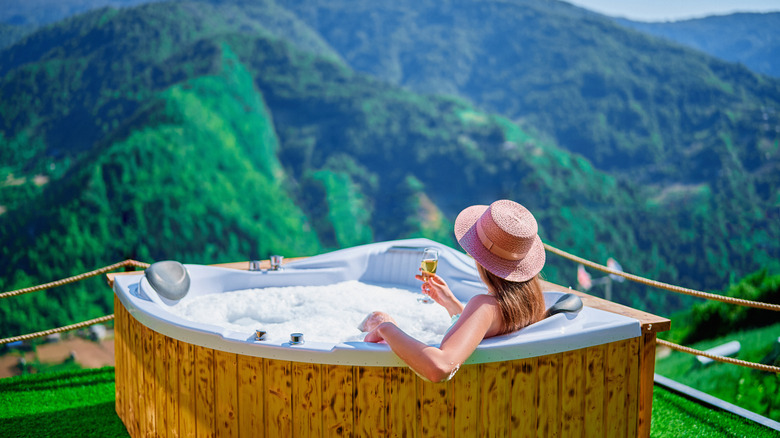 lady in outdoor bath tub