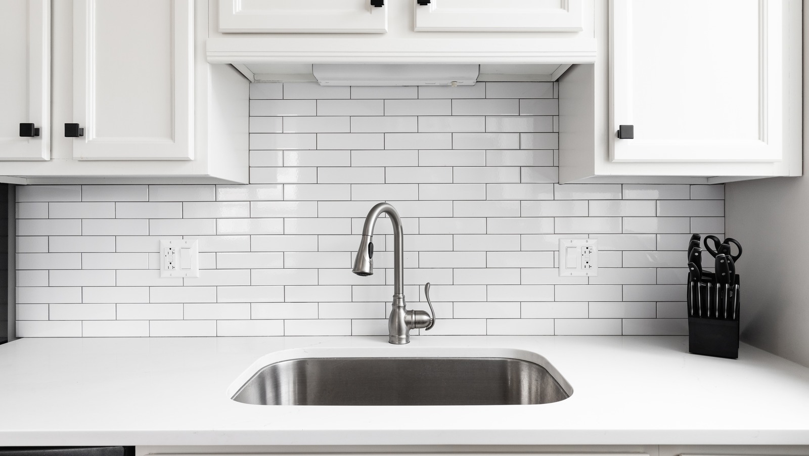 sanitizing kitchen counters and sink with bleach