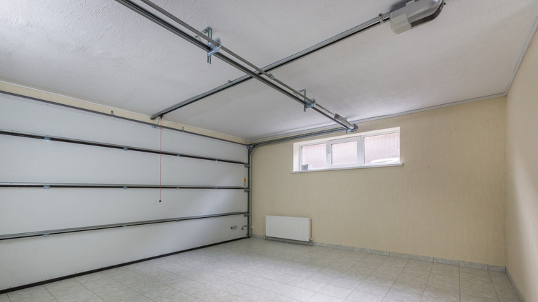 A modern garage with electric door and window near the ceiling