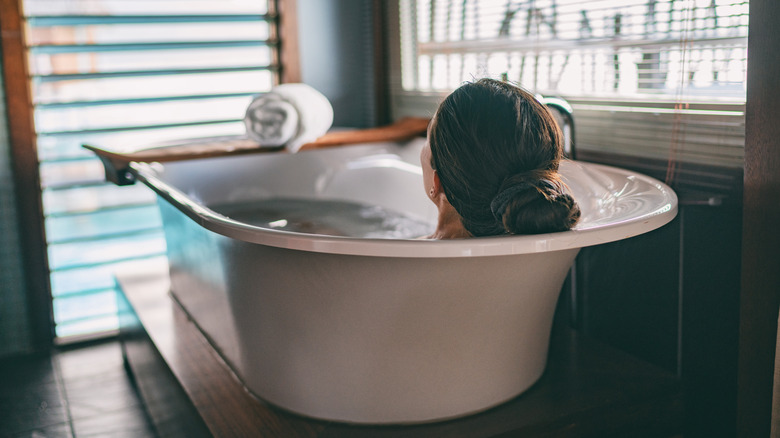 Woman relaxing in tub