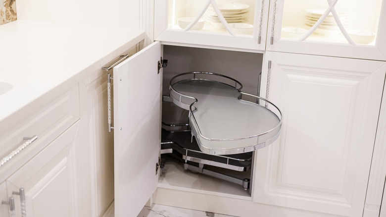 A pull-out sheld emerging from a blind corner cabinet