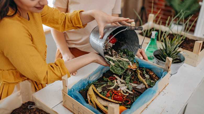 Woman using homemade compost